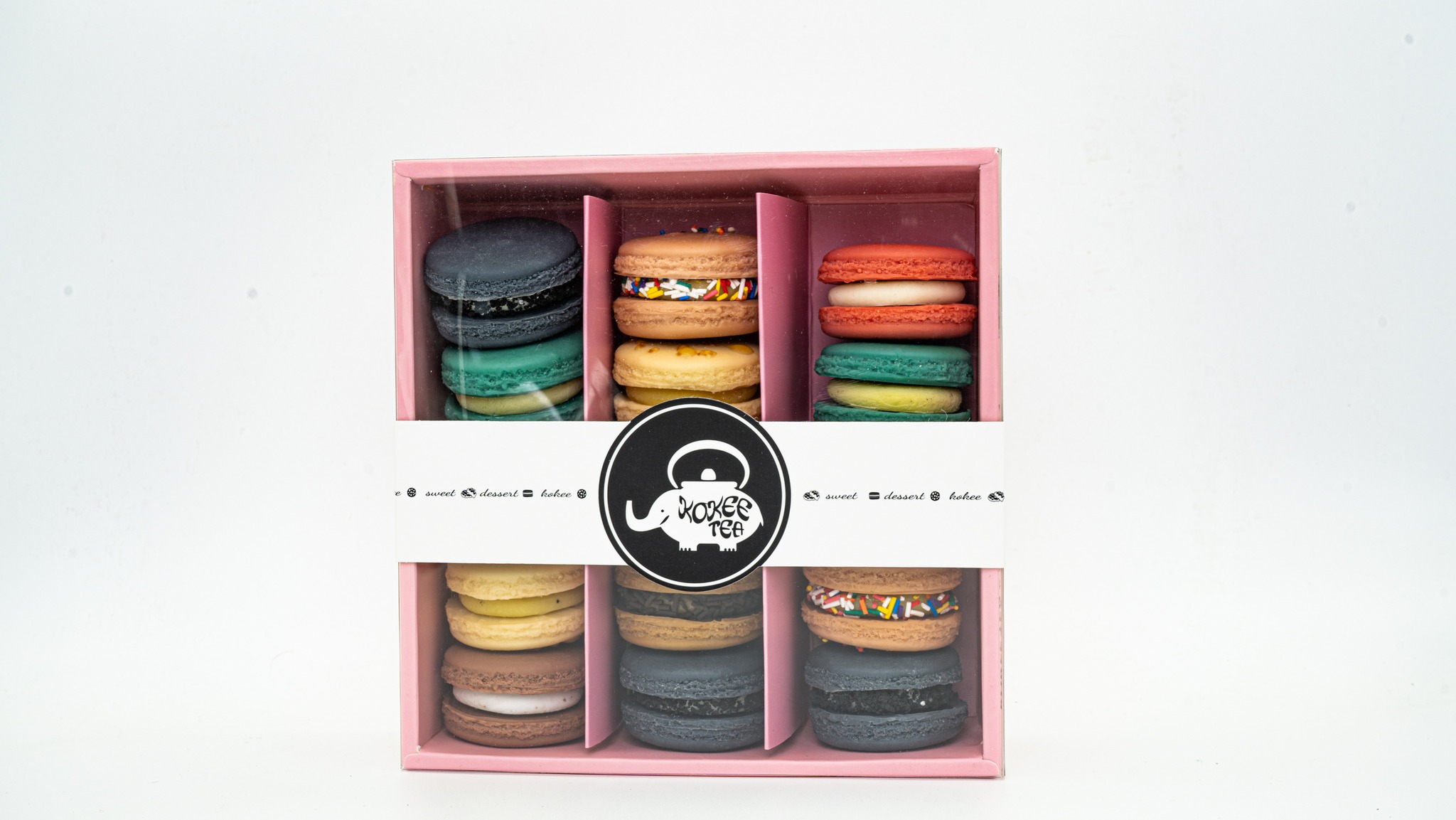 A box of delightful macarons reflecting the joy and positive energy that Kokee Tea aims to bring to its customers.