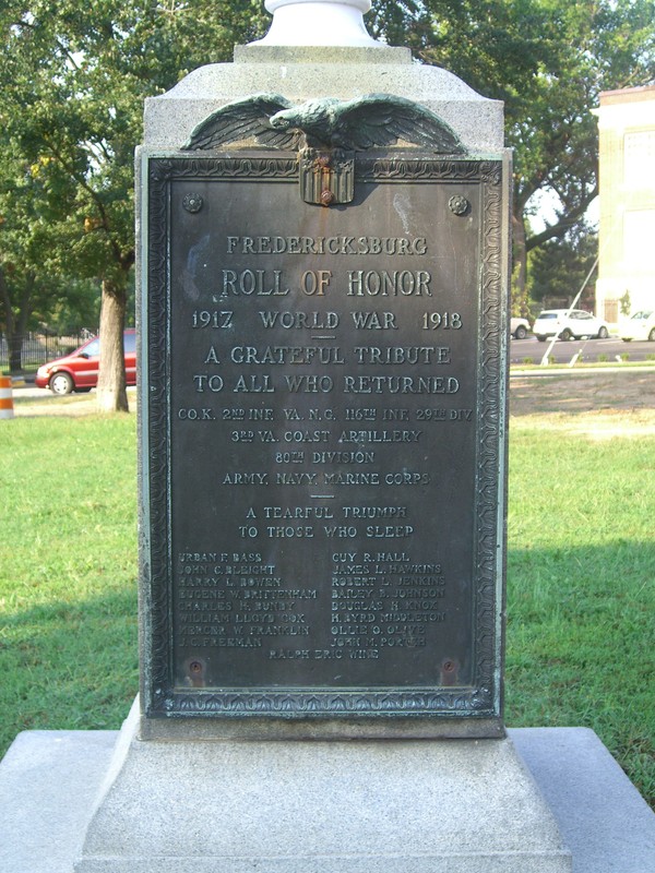The WWI memorial flagpole and plaque — reminders of Fredericksburg's early commemorations.